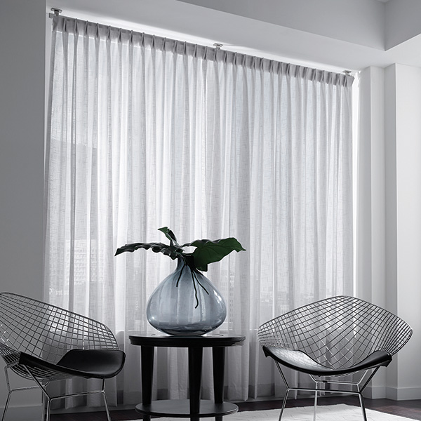 A room with the sheers closed to let in less light.